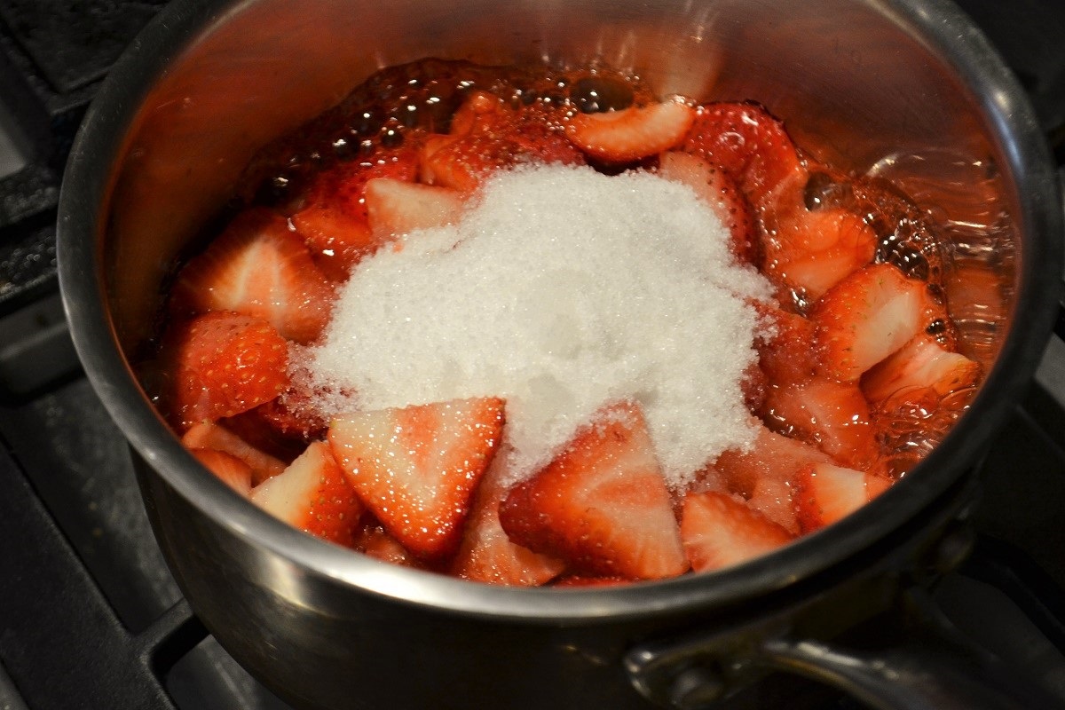 strawberries and sugar in pan
